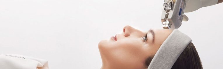 Close up of medical botox injection in lips over white background. Facial treatment.